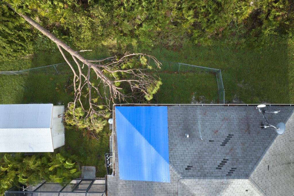 An aerial view of a house with a blue roof.